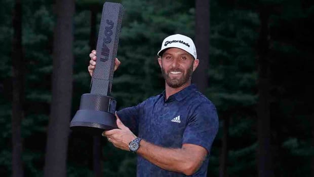 Dustin Johnson is pictured with the winner's trophy from the 2022 LIV Golf Invitational Series event outside Boston.