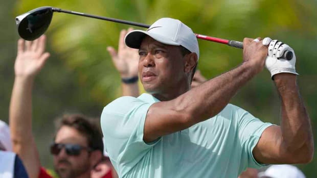 Tiger Woods watches his shot on the fourth tee during the third round of the 2023 Hero World Challenge.