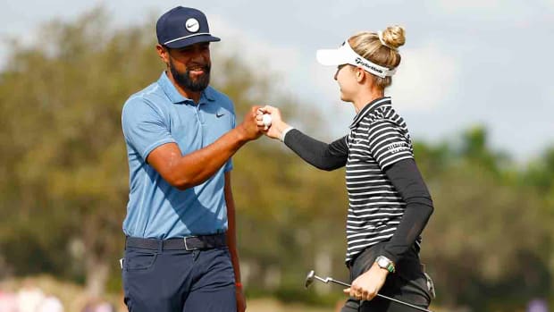 Tony Finau and Nelly Korda bump fists on the ninth green during the first round of the Grant Thornton Invitational at Tiburon Golf Club on Dec. 8, 2023 in Naples, Fla.