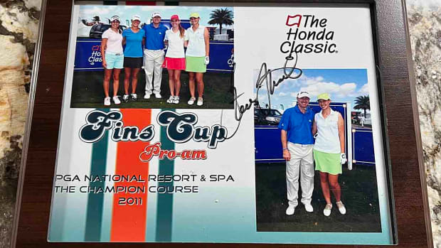 Kelly Okun's plaque from the 2011 Honda Classic pro-am, including a picture of her with pro Steve Flesch.