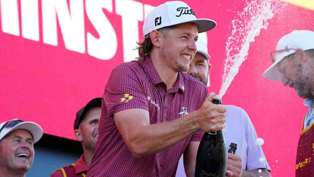 Cameron Smith sprays champagne as his Ripper GC are the champions of the LIV Golf Bedminster golf tournament at Trump National Bedminster on Sunday, Aug. 13, 2023.
