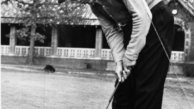 Boxer Joe Louis playing golf
