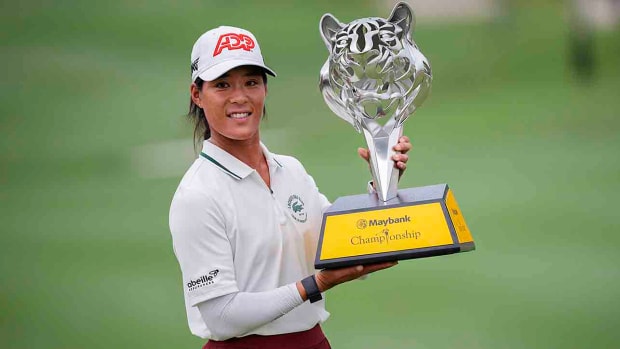 Celine Boutier of France celebrates with the winner's trophy after winning the final round of the 2023 LPGA Maybank Championship in Kuala Lumpur, Malaysia.