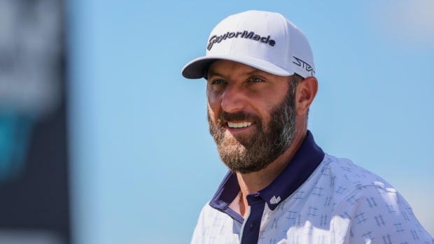 Dustin Johnson smiles while playing the LIV Golf Miami event in Doral, Fla.