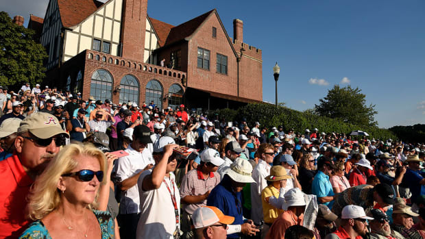 Fans and the clubhouse at East Lake Golf Club in Atlanta.