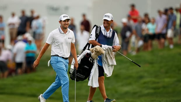 Patrick Cantlay walks with his caddie at the 2021 BMW Championship.