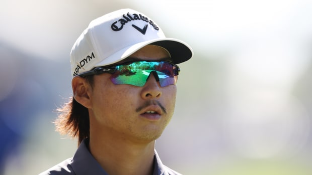 Min Woo Lee of Australia looks on during the third round of the Players Championship.