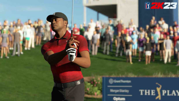 Tiger Woods is pictured swinging in the PGA Tour 2K23 video game.