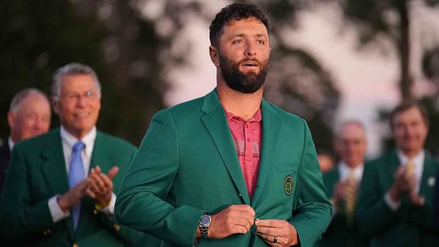 Jon Rahm is pictured wearing the green jacket after winning the 2023 Masters.