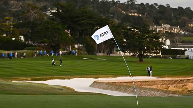 A view of the pin flag being blown by the wind at the 18th hole during the first round of the 2023 AT&T Pebble Beach Pro-Am.