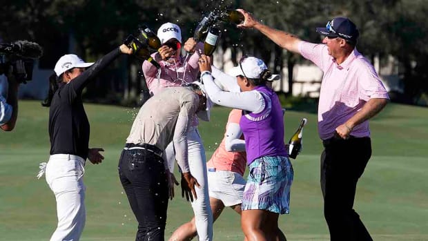 Amy Yang second from left, is sprayed with champagne after winning the 2023 LPGA CME Group Tour Championship.