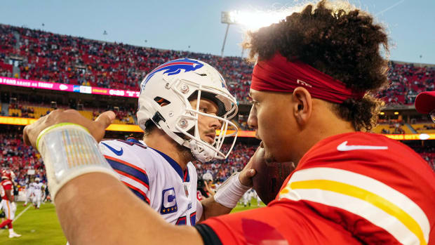Josh Allen and Patrick Mahomes meet at midfield after a game.
