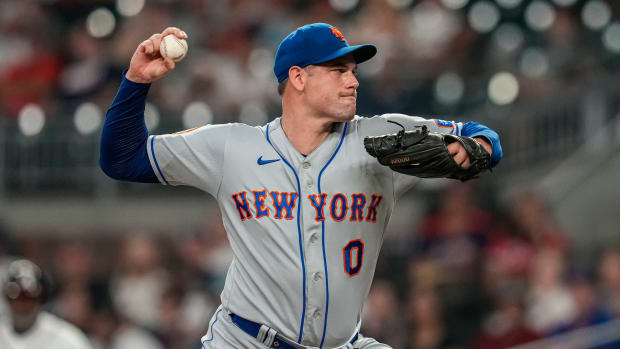 Aug 21, 2023; Cumberland, Georgia, USA; New York Mets relief pitcher Adam Ottavino (0) pitches against the Atlanta Braves during the eighth inning at Truist Park. Mandatory Credit: Dale Zanine-USA TODAY Sports