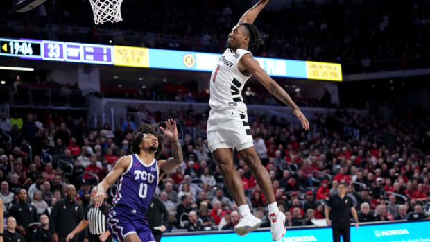 Cincinnati Bearcats guard Day Day Thomas (1) dunks in the second half of a college basketball game between the TCU Horned Frogs and the Cincinnati Bearcats, Tuesday, Jan. 16, 2024, at Fifth Third Arena in Cincinnati. The Cincinnati Bearcats won, 81-77.