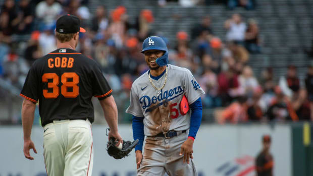 Sep 18, 2022; San Francisco, California, USA; San Francisco Giants starting pitcher Alex Cobb (38) and Los Angeles Dodgers right fielder Mookie Betts (50) exchange words during a replay in the first inning at Oracle Park.