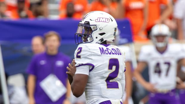 Sept 9, 2023; Charlottesville, Virginia, USA; James Madison Dukes quarterback Jordan McCloud (2) looks for a pass to an open player during the second half of the game against the Virginia Cavaliers at Scott Stadium. Mandatory Credit: Hannah Pajewski-USA TODAY Sports  