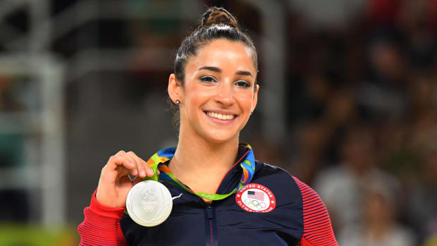 Olympic gymnast Aly Raisman holds her silver medal at the 2016 Rio Olympics.
