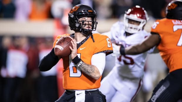 Nov 30, 2019; Stillwater, OK, USA; Oklahoma State Cowboys quarterback Dru Brown (6) drops back to pass against the Oklahoma Sooners during the first half at Boone Pickens Stadium. Mandatory Credit: Rob Ferguson-USA TODAY Sports  