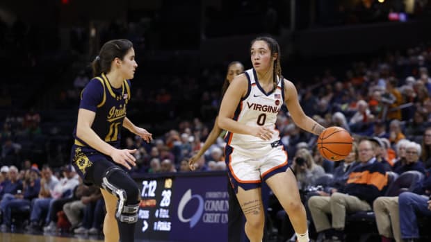 Olivia McGhee handles the ball during the Virginia women's basketball game against Notre Dame at John Paul Jones Arena.