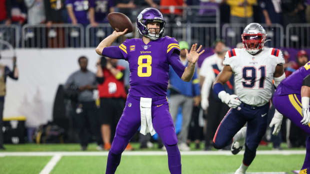 Nov 24, 2022; Minneapolis, Minnesota, USA; Minnesota Vikings quarterback Kirk Cousins (8) throws the ball against the New England Patriots during the first quarter at U.S. Bank Stadium.
