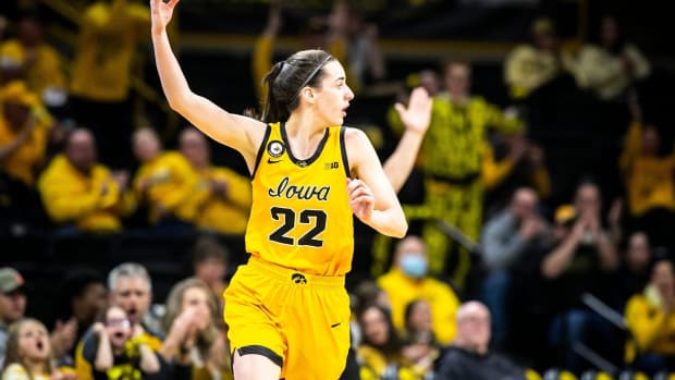Iowa guard Caitlin Clark (22) reacts after making a 3-point basket during a NCAA Big Ten Conference women's basketball game against Ohio State, Monday, Jan. 31, 2022, at Carver-Hawkeye Arena in Iowa City, Iowa.