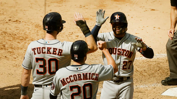 May 6, 2021; Bronx, New York, USA; Houston Astros second baseman Jose Altuve (27) is congratulated by Houston Astros right fielder Kyle Tucker (30) and pinch runner Chas McCormick (20) after hitting a game winning three run home run against the New York Yankees during the eighth inning at Yankee Stadium. Mandatory Credit: Andy Marlin-USA TODAY Sports