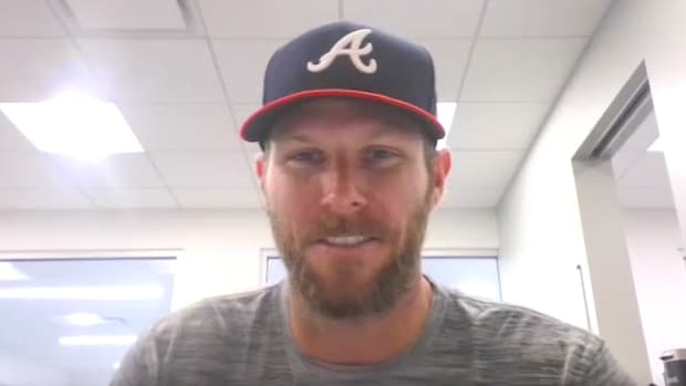 Chris Sale speaks to reporters while wearing a Braves hat from the team's spring training facility in North Port, FL