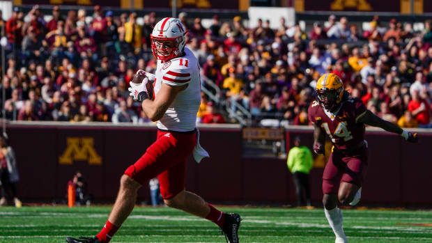Oct 16, 2021; Minneapolis, Minnesota, USA; Nebraska Cornhuskers tight end Austin Allen (11) runs with the ball after the catch against the Minnesota Golden Gophers during the third quarter at Huntington Bank Stadium. Mandatory Credit: Nick Wosika-USA TODAY Sports  