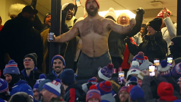 Philadelphia Eagles center Jason Kelce, shirtless and chugging beer, cheers on brother Travis Kelce and the Kansas City Chiefs.