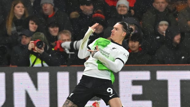 Darwin Nunez pictured celebrating after scoring the 100th goal of his senior career during Liverpool's 4-0 win at Bournemouth in January 2024