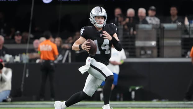 Aug 13, 2023; Paradise, Nevada, USA; Las Vegas Raiders quarterback Chase Garbers (14) carries the ball against the San Francisco 49ers in the second half at Allegiant Stadium. Mandatory Credit: Kirby Lee-USA TODAY Sports  