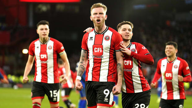 Sheffield United striker Oli McBurnie pictured (center) celebrating after scoring the latest goal in Premier League history by converting a penalty kick in the 103rd minute of his team's 2-2 draw against West Ham in January 2024