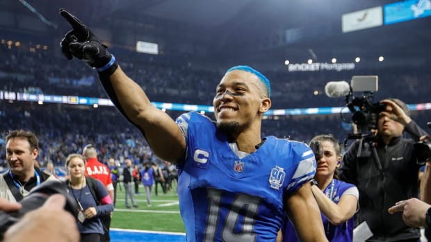 Detroit Lions wide receiver Amon-Ra St. Brown celebrates the 31-23 win over the Tampa Bay Buccaneers in the NFC divisional round at Ford Field in Detroit on Sunday, Jan. 21, 2024.  