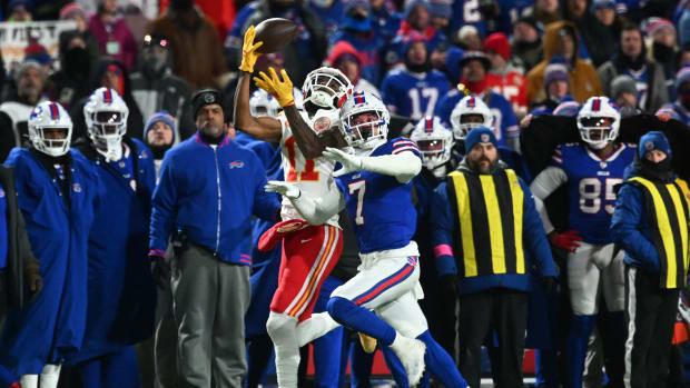 Jan 21, 2024; Orchard Park, New York, USA; Kansas City Chiefs wide receiver Marquez Valdes-Scantling (11) makes a catch over Buffalo Bills cornerback Taron Johnson (7) in the first half of the 2024 AFC divisional round game at Highmark Stadium. Mandatory Credit: Mark Konezny-USA TODAY Sports  
