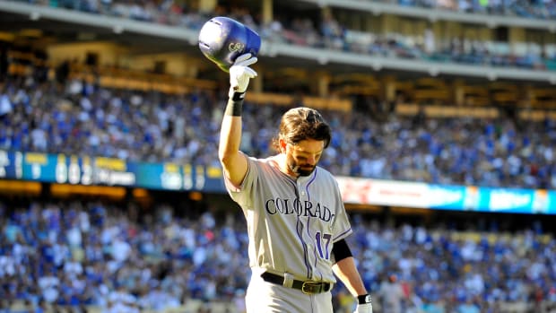 September 29, 2013; Los Angeles, CA, USA; Colorado Rockies first baseman Todd Helton (17) acknowledges the crowd following his final at bat of the game in the ninth inning against the Los Angeles Dodgers at Dodger Stadium.