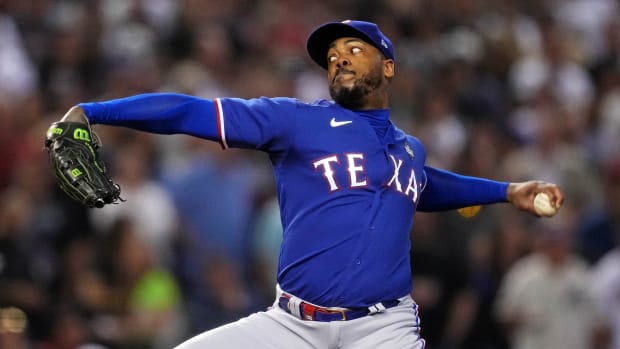 Texas Rangers relief pitcher Aroldis Chapman (45) pitches during the seventh inning against the Arizona Diamondbacks during game five of the 2023 World Series at Chase Field.  