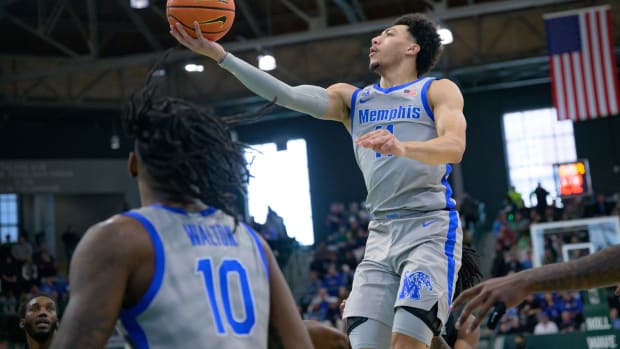 Jan 21, 2024; New Orleans, Louisiana, USA; Memphis Tigers guard Jahvon Quinerly (11) shoots against the Tulane Green Wave during the first half at Avron B. Fogelman Arena in Devlin Fieldhouse. Mandatory Credit: Matthew Hinton-USA TODAY Sports  