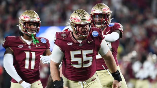 Dec 2, 2023; Charlotte, NC, USA; Florida State Seminoles defensive lineman Braden Fiske (55) reacts after a tackle on Louisville Cardinals running back Jawhar Jordan (25) in the first quarter at Bank of America Stadium.