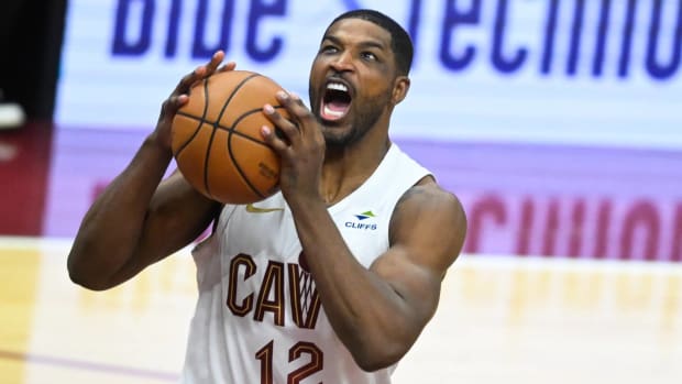 Cavaliers forward Tristan Thompson reacts after grabbing a rebound in a game.