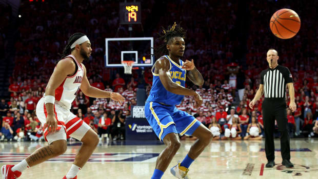 UCLA Bruins guard Dylan Andrews (2) makes a pass against Arizona Wildcats guard Kylan Boswell 