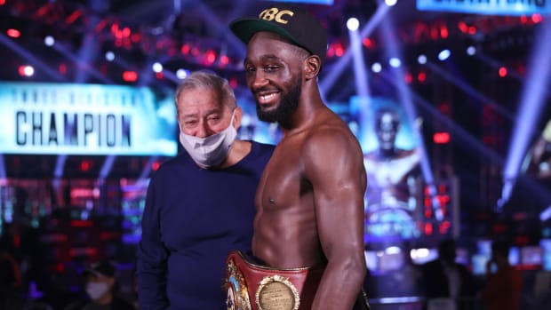 Terence Crawford with Top Rank Boxing's Bob Arum following a successful title fight.