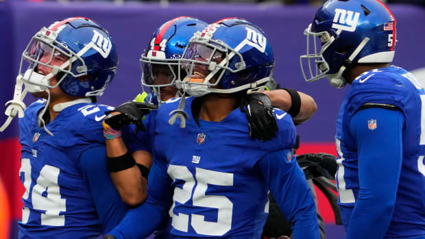 Nov 26, 2023; East Rutherford, New Jersey, USA; New York Giants cornerback Deonte Banks (25) celebrates an interception against New England Patriots in the 1st half at MetLife Stadium.
