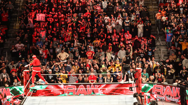 Fans watch ”WWE Monday Night RAW” at Wells Fargo Arena in Des Moines.