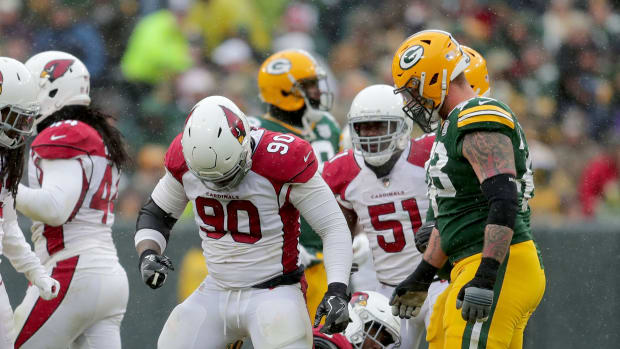 Arizona Cardinals defensive tackle Robert Nkemdiche (90) stands over Green Bay Packers running back Aaron Jones (33) during the 3rd quarter of Green Bay Packers game 20-17 loss against the Arizona Cardinals on Sunday, December 2, 2018 at Lambeau Field in Green Bay, Wis. Mike De Sisti / USA TODAY NETWORK-Wis Packers03 Packers Desisti 05233  