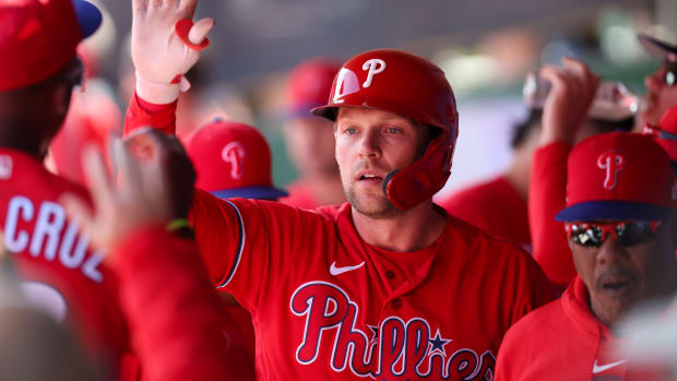 Mar 19, 2023; Clearwater, Florida, USA; Philadelphia Phillies first baseman Rhys Hoskins (17) is congratulated after hitting a home run against the Boston Red Sox in the first inning at BayCare Ballpark.