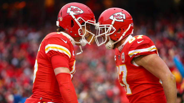 Kansas City Chiefs quarterback Patrick Mahomes (15) and tight end Travis Kelce (87) celebrate a touchdown against the Houston Texans during the second quarter in a AFC divisional round playoff game.
