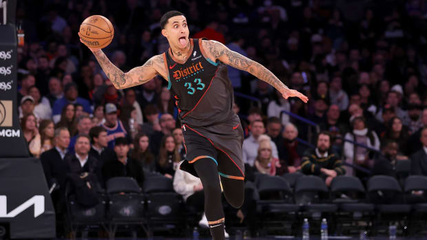 Caption: Jan 18, 2024; New York, New York, USA; Washington Wizards forward Kyle Kuzma (33) looks to pass the ball against the New York Knicks during the third quarter at Madison Square Garden. Mandatory Credit: Brad Penner-USA TODAY Sports