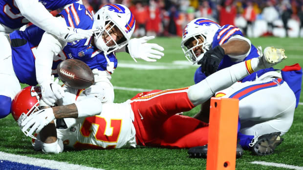 Jan 21, 2024; Orchard Park, New York, USA; Buffalo Bills safety Jordan Poyer (21) causes a fumble on Kansas City Chiefs wide receiver Mecole Hardman Jr. (12) through the end zone for a touchback during the second half for the 2024 AFC divisional round game at Highmark Stadium. Mandatory Credit: Mark J. Rebilas-USA TODAY Sports