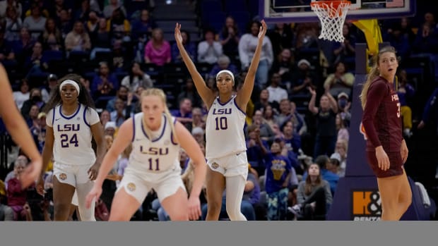 Nov 30, 2023; Baton Rouge, Louisiana, USA; LSU Lady Tigers forward Angel Reese (10) pumps up the crowd during the first half against the Virginia Tech Hokies at Pete Maravich Assembly Center.