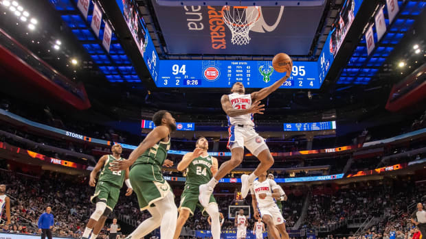 Detroit Pistons guard Marcus Sasser drives to the basket in front of Milwaukee Bucks forward Khris Middleton, guard Malik Beasley and guard Pat Connaughton.